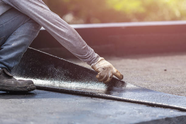 Professional Emergency Waterproofing technician working in Louisville, IL